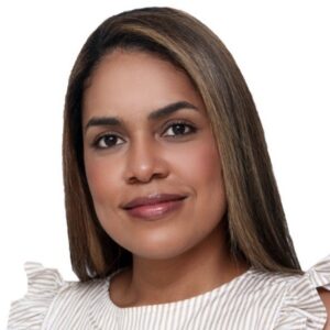 A professional portrait of Kelli Jimenez, digital marketing expert and market researcher, smiling and dressed in business attire.
