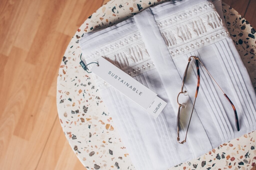 Cover of a market analysis report on consumer preferences in sustainable fashion with eco-friendly icons and fashion elements.